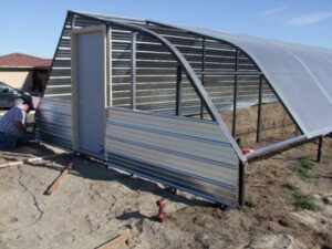 Construction of Finch's passive solar greenhouse.