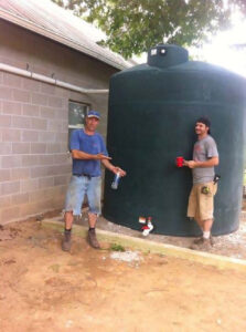 Newly installed cistern attached to farm building