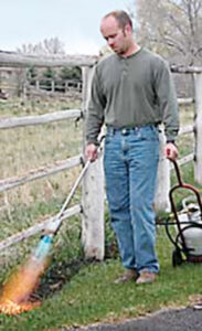 Using a hand-held propane torch Photo: Flame Engineering