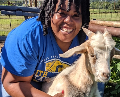 NCAT Specialist Asha Tillman with a goat