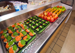 vegetables and fruits in school lunch distribution display