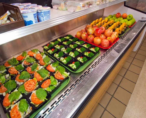 vegetables and fruits in school lunch distribution display