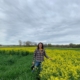 woman standing in field planted with cover crop