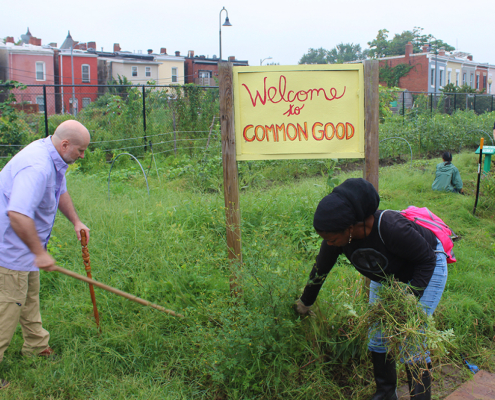 Man and woman working at Common Good Garden in Washington, DC