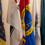 a row of flags of Tribal nations
