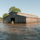 floodwaters surround a barn
