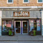 storefront with plants in front