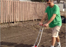 SPIN farmer Wally Satzewich of Wally’s Urban Market Garden in Saskatoon, Saskatchewan, using an Earthway seeder