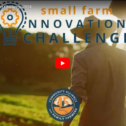 Small Farm Innovation Challenge logo over video thumbnail of person in a hat walking away across field in golden light.