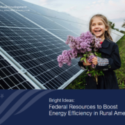 publication cover with photo of girl holding flowers standing in front of solar array.