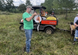 Photo of Buck Holsinger explains the use of polywire at the Armed to Farm training at Holsinger Homestead Farm, August 2024.