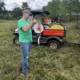 Photo of Buck Holsinger explains the use of polywire at the Armed to Farm training at Holsinger Homestead Farm, August 2024.