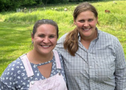 Photo of Liz Mashie (left) and Emily Jost, May 2024, at a farm tour