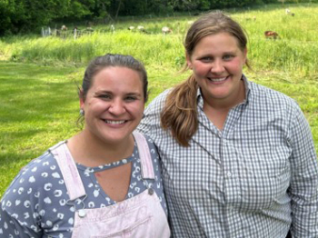 Photo of Liz Mashie (left) and Emily Jost, May 2024, at a farm tour