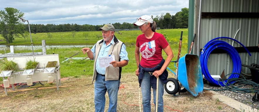 Photo of Tony and LeVonna Uekman discussing the afternoon agenda at Grazing 101