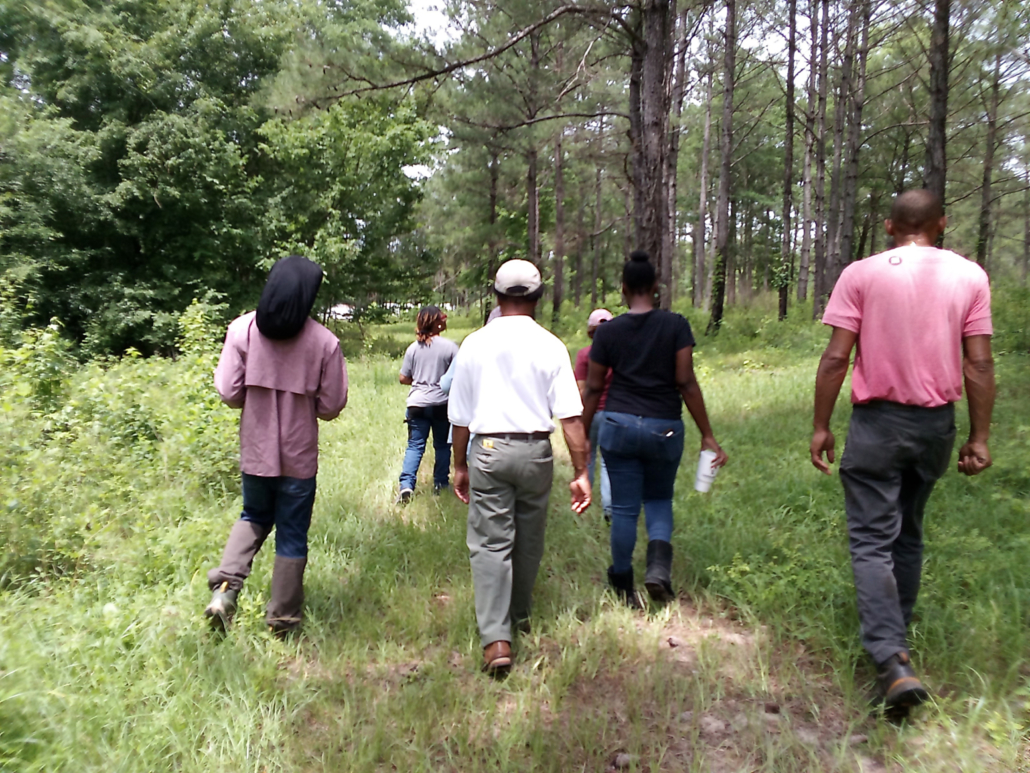 Photo of Women, Livestock, and the Land program participants gathered in May 2024