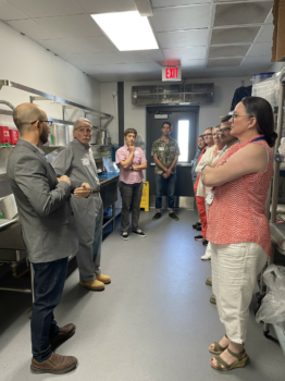 Attendees at a school district site visit to learn about its local food purchasing