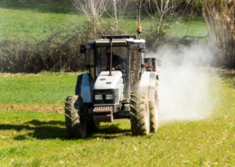 Photo of tractor spreading lime in a field