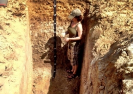 Dr. Faye Smith Measuring Soil Health in a soil pit.