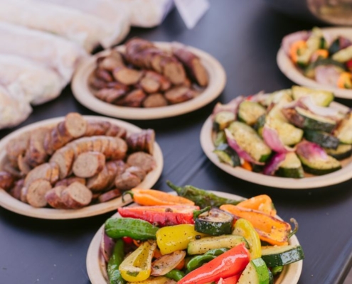 plates of prepared vegetables on a table