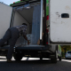 A person removing boxes from an insulated box truck